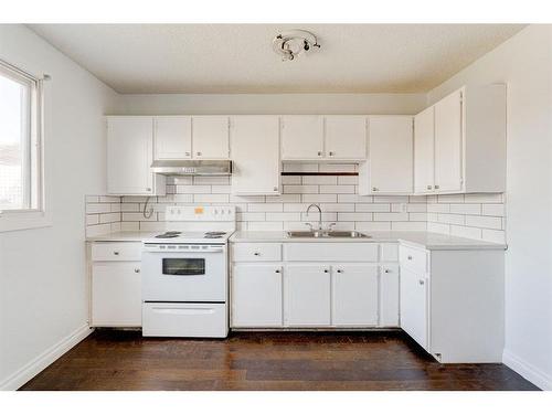 4851 Mardale Road Ne, Calgary, AB - Indoor Photo Showing Kitchen With Double Sink