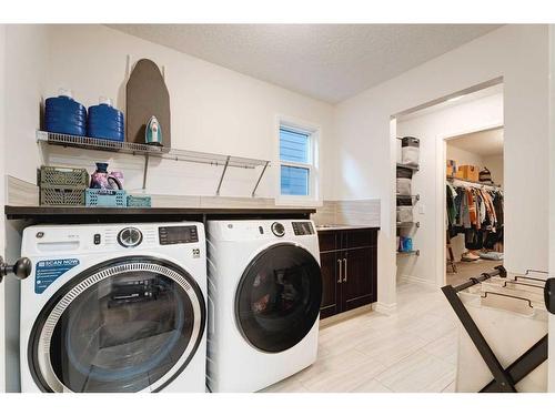 50 Riviera View, Cochrane, AB - Indoor Photo Showing Laundry Room