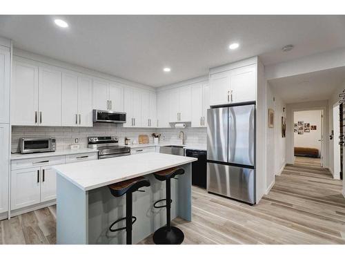 50 Riviera View, Cochrane, AB - Indoor Photo Showing Kitchen With Stainless Steel Kitchen