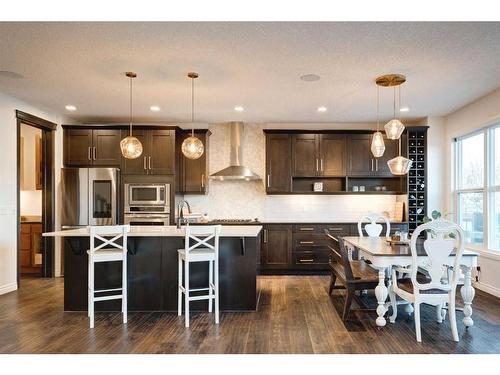 50 Riviera View, Cochrane, AB - Indoor Photo Showing Kitchen With Stainless Steel Kitchen With Upgraded Kitchen