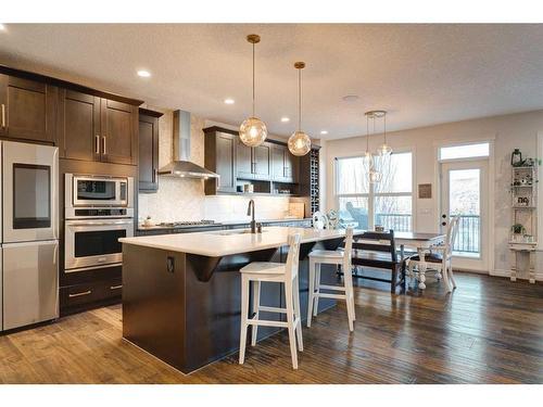 50 Riviera View, Cochrane, AB - Indoor Photo Showing Kitchen With Stainless Steel Kitchen With Upgraded Kitchen