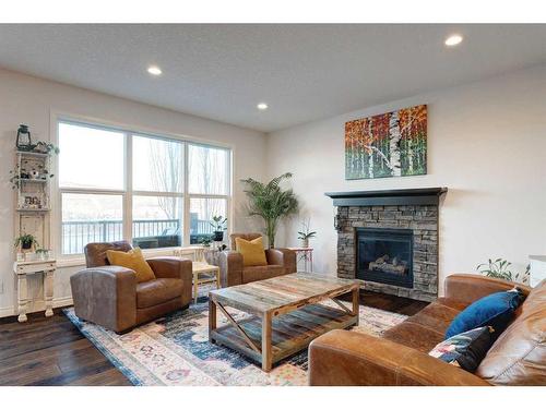 50 Riviera View, Cochrane, AB - Indoor Photo Showing Living Room With Fireplace