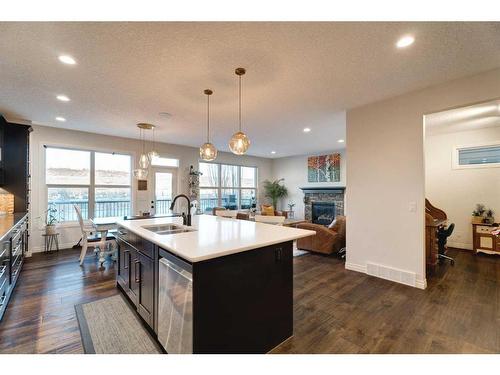 50 Riviera View, Cochrane, AB - Indoor Photo Showing Kitchen With Double Sink With Upgraded Kitchen