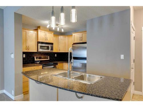 1104-5605 Henwood Street Sw, Calgary, AB - Indoor Photo Showing Kitchen With Double Sink