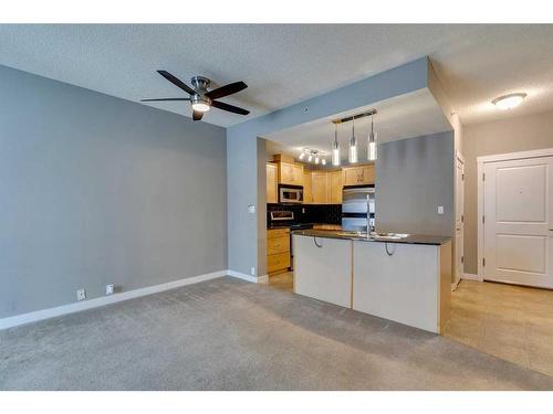 1104-5605 Henwood Street Sw, Calgary, AB - Indoor Photo Showing Kitchen With Double Sink