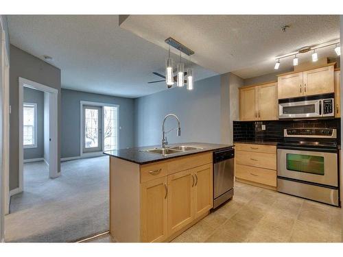 1104-5605 Henwood Street Sw, Calgary, AB - Indoor Photo Showing Kitchen With Double Sink