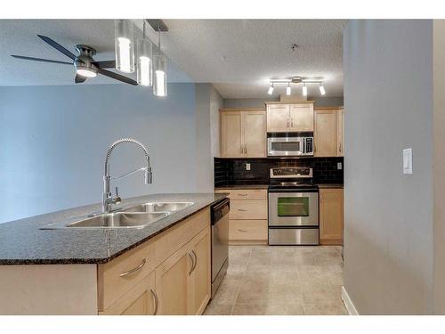 1104-5605 Henwood Street Sw, Calgary, AB - Indoor Photo Showing Kitchen With Double Sink