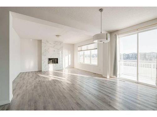 76 Carrington Close Nw, Calgary, AB - Indoor Photo Showing Living Room With Fireplace