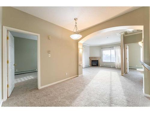 406-881 15 Avenue Sw, Calgary, AB - Indoor With Fireplace