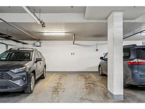 104-35 Aspenmont Heights Sw, Calgary, AB - Indoor Photo Showing Garage