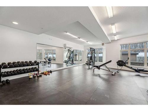 104-35 Aspenmont Heights Sw, Calgary, AB - Indoor Photo Showing Gym Room