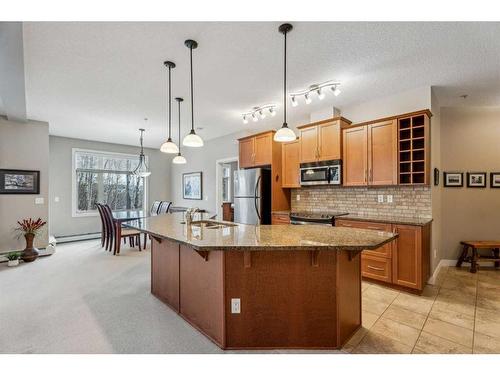 104-35 Aspenmont Heights Sw, Calgary, AB - Indoor Photo Showing Kitchen With Stainless Steel Kitchen With Upgraded Kitchen