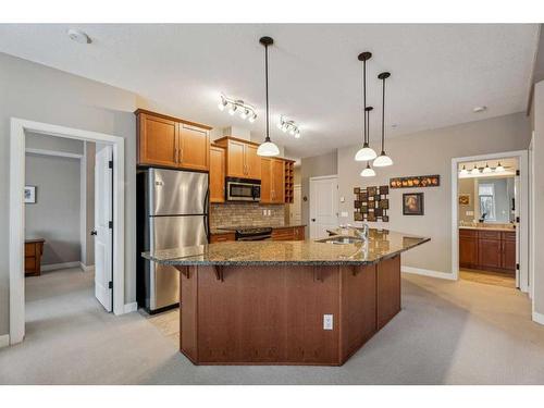 104-35 Aspenmont Heights Sw, Calgary, AB - Indoor Photo Showing Kitchen