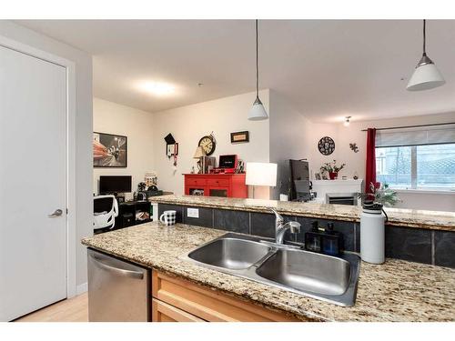 105-303 19 Avenue Sw, Calgary, AB - Indoor Photo Showing Kitchen With Double Sink