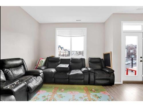 202-135 Redstone Ne, Calgary, AB - Indoor Photo Showing Living Room