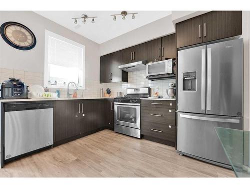 202-135 Redstone Ne, Calgary, AB - Indoor Photo Showing Kitchen With Stainless Steel Kitchen