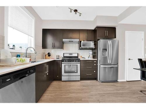 202-135 Redstone Ne, Calgary, AB - Indoor Photo Showing Kitchen With Stainless Steel Kitchen