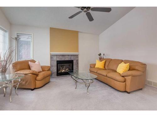 2038 Bridlemeadows Manor Sw, Calgary, AB - Indoor Photo Showing Living Room With Fireplace