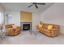 2038 Bridlemeadows Manor Sw, Calgary, AB  - Indoor Photo Showing Living Room With Fireplace 