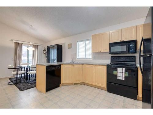 2038 Bridlemeadows Manor Sw, Calgary, AB - Indoor Photo Showing Kitchen