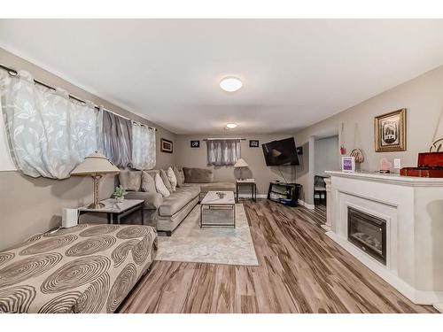 915 39 Street Se, Calgary, AB - Indoor Photo Showing Living Room With Fireplace