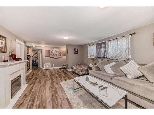 915 39 Street Se, Calgary, AB - Indoor Photo Showing Living Room With Fireplace