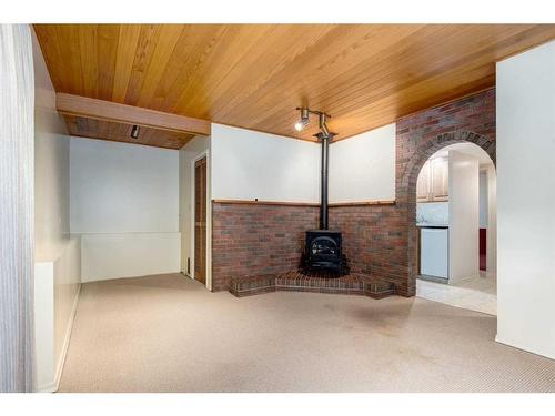 83 Chancellor Way Nw, Calgary, AB - Indoor Photo Showing Other Room With Fireplace