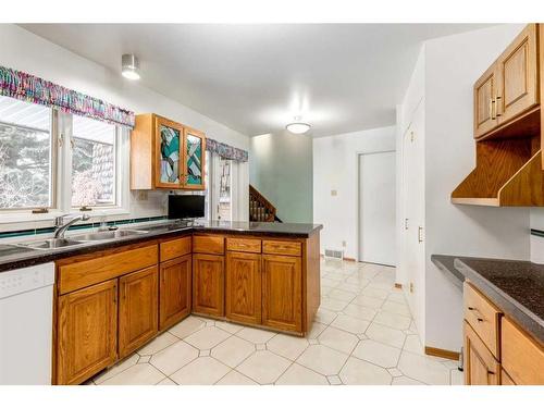 83 Chancellor Way Nw, Calgary, AB - Indoor Photo Showing Kitchen With Double Sink