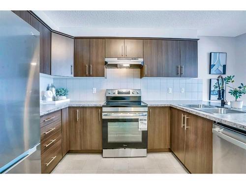 6 Cityscape Avenue Ne, Calgary, AB - Indoor Photo Showing Kitchen With Stainless Steel Kitchen With Double Sink