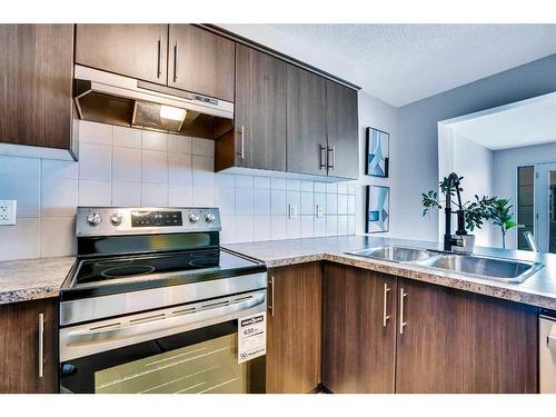 6 Cityscape Avenue Ne, Calgary, AB - Indoor Photo Showing Kitchen With Stainless Steel Kitchen With Double Sink