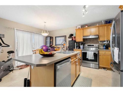 308 Evermeadow Road Sw, Calgary, AB - Indoor Photo Showing Kitchen With Double Sink