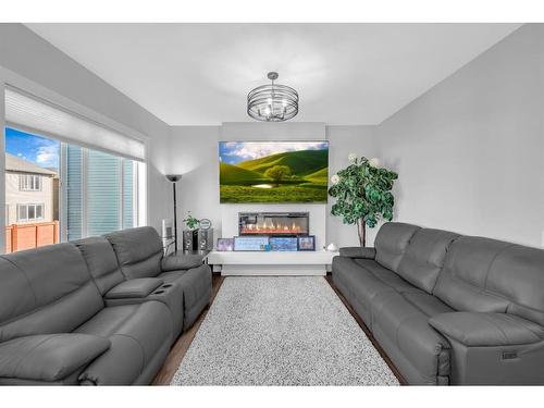 469 Creekrun Crescent Sw, Airdrie, AB - Indoor Photo Showing Living Room With Fireplace