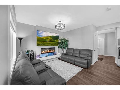 469 Creekrun Crescent Sw, Airdrie, AB - Indoor Photo Showing Living Room With Fireplace