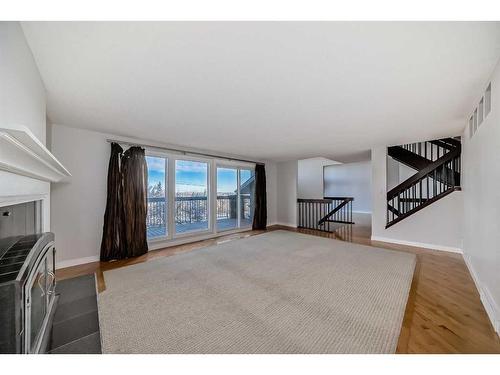 5823 Coach Hill Road Sw, Calgary, AB - Indoor Photo Showing Living Room With Fireplace