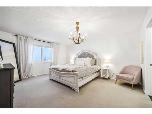 117 Drake Landing View, Okotoks, AB - Indoor Photo Showing Bedroom