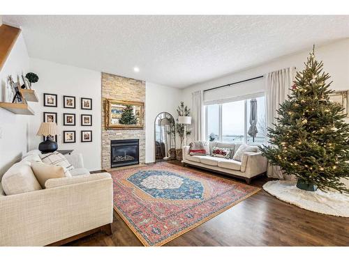 117 Drake Landing View, Okotoks, AB - Indoor Photo Showing Living Room With Fireplace