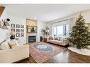 117 Drake Landing View, Okotoks, AB  - Indoor Photo Showing Living Room With Fireplace 