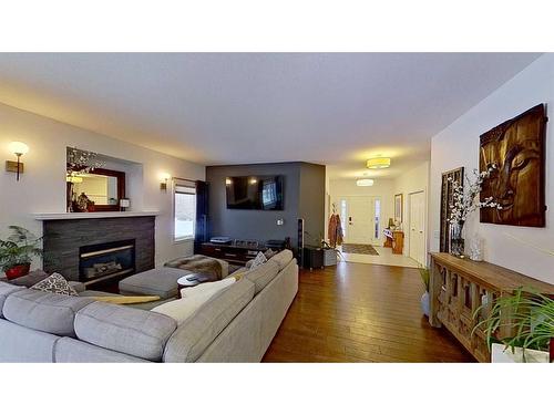 292185 Township Road 264, Rural Rocky View County, AB - Indoor Photo Showing Living Room With Fireplace