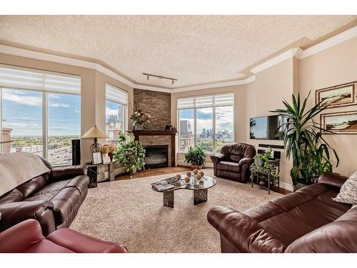 904-1726 14 Avenue Nw, Calgary, AB - Indoor Photo Showing Living Room With Fireplace