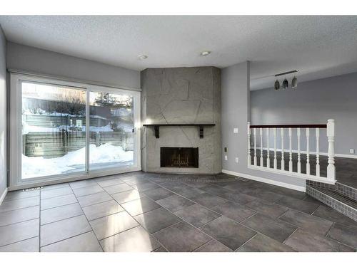 10-448 Strathcona Drive Sw, Calgary, AB - Indoor Photo Showing Other Room With Fireplace