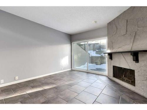 10-448 Strathcona Drive Sw, Calgary, AB - Indoor With Fireplace