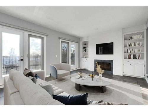 10-448 Strathcona Drive Sw, Calgary, AB - Indoor Photo Showing Living Room With Fireplace