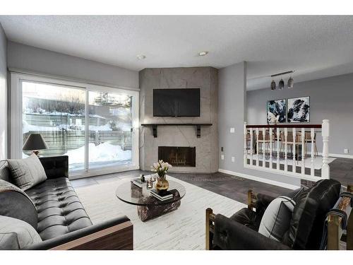 10-448 Strathcona Drive Sw, Calgary, AB - Indoor Photo Showing Living Room With Fireplace