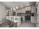 309-93 34 Avenue Sw, Calgary, AB  - Indoor Photo Showing Kitchen With Stainless Steel Kitchen With Upgraded Kitchen 