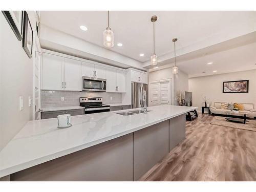 4377 Seton Drive Se, Calgary, AB - Indoor Photo Showing Kitchen With Stainless Steel Kitchen With Double Sink With Upgraded Kitchen