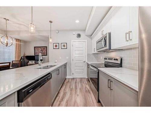 4377 Seton Drive Se, Calgary, AB - Indoor Photo Showing Kitchen With Stainless Steel Kitchen With Double Sink With Upgraded Kitchen