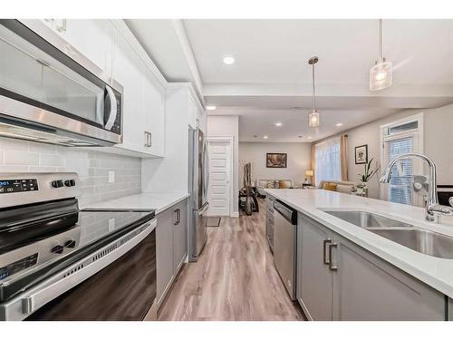 4377 Seton Drive Se, Calgary, AB - Indoor Photo Showing Kitchen With Stainless Steel Kitchen With Double Sink With Upgraded Kitchen