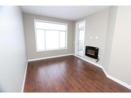 315-22 Auburn Bay Link Se, Calgary, AB - Indoor With Fireplace