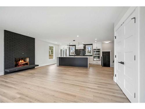 36 Maple Court Crescent Se, Calgary, AB - Indoor Photo Showing Living Room With Fireplace