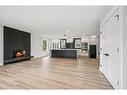 36 Maple Court Crescent Se, Calgary, AB  - Indoor Photo Showing Living Room With Fireplace 